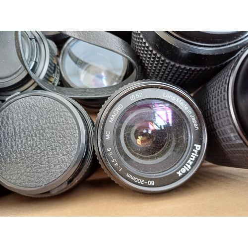 618 - A collection of camera lenses to include Chinon, Olympus Zuiko Digital, Olympus Zuiko OM-System, Min... 