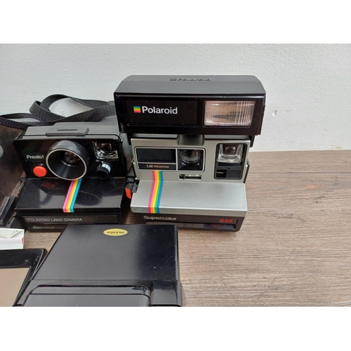 622 - A collection of instant cameras to include Fujifilm Instax 200 and 210, Polaroid Joycam, Polaroid Su... 