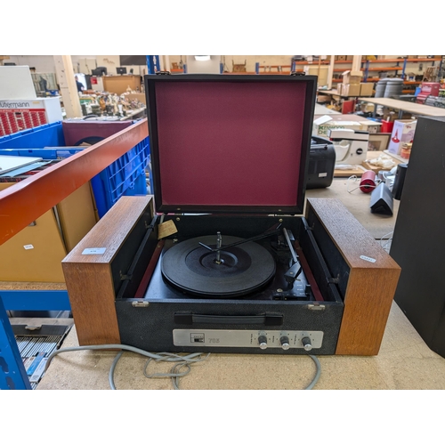 679 - An Ekco 703 four-speed autochanger record player with detachable speakers