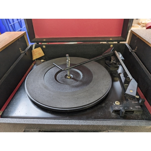 679 - An Ekco 703 four-speed autochanger record player with detachable speakers