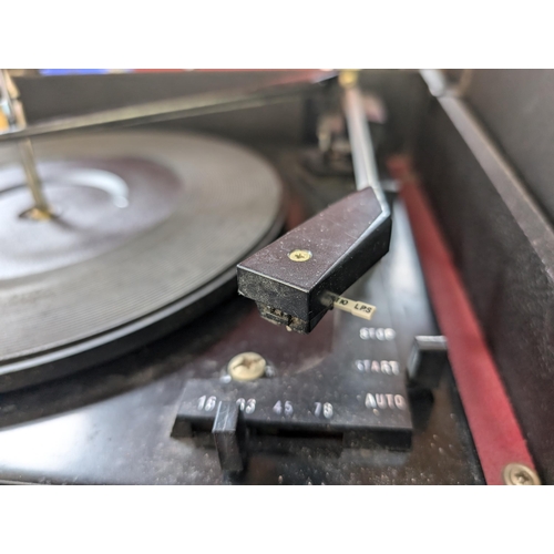 679 - An Ekco 703 four-speed autochanger record player with detachable speakers