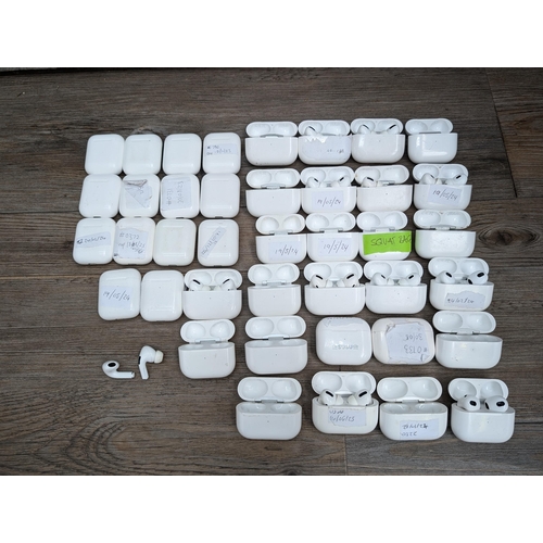 683 - A collection of Apple AirPod and AirPod style charging cases some with contents