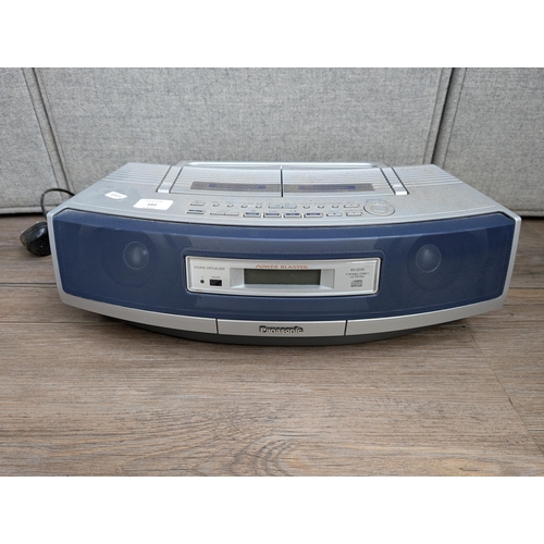 684 - A Panasonic RX-ED50 portable stereo system comprising twin cassette deck, CD player and tuner