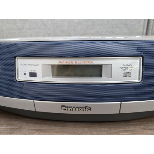 684 - A Panasonic RX-ED50 portable stereo system comprising twin cassette deck, CD player and tuner