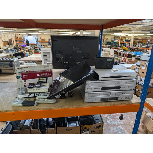 690 - A collection of AV items to include Bush and Daewoo VCR/DVD players, Blaupunkt 23.6