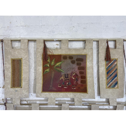 267 - A late 20th century African needlepoint wall hanging - approx. 133cm high x 87cm wide