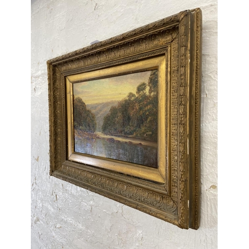 275 - A late 19th/early 20th century gilt framed T. Marshall Furness oil on board of a river scene - appro... 