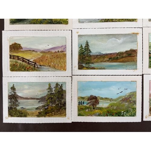 281 - A photograph album containing a collection of vintage acrylic on board paintings of landscape scenes... 