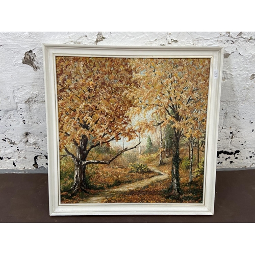 284 - A mid 20th century framed acrylic on board of a woodland scene titled 'Autumn Sunlight' signed lower... 