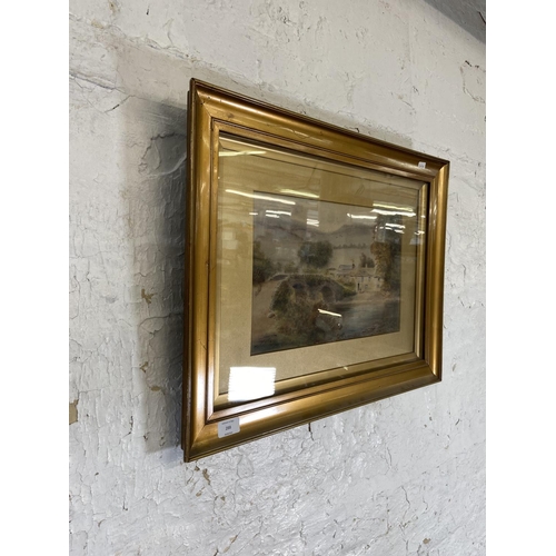 288 - A late 19th/early 20th century gilt framed J. W. Stedman watercolour of a village scene signed lower... 