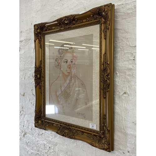 289 - A late 20th century gilt framed pastel portrait of an Oriental lady - approx. 63cm high x 53cm wide