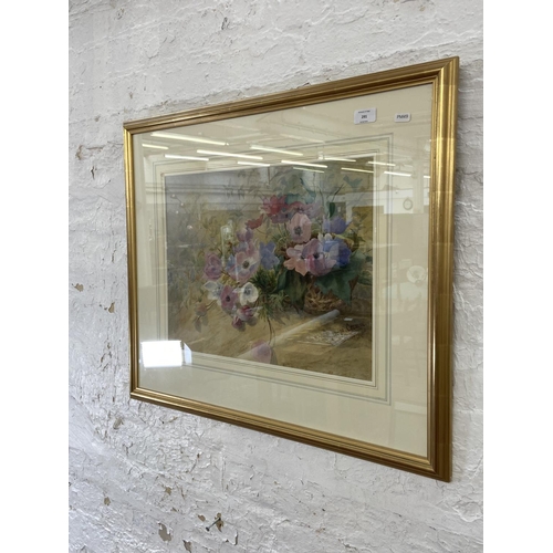 291 - A modern gilt framed watercolour of a still life floral scene signed lower right - approx. 65cm high... 