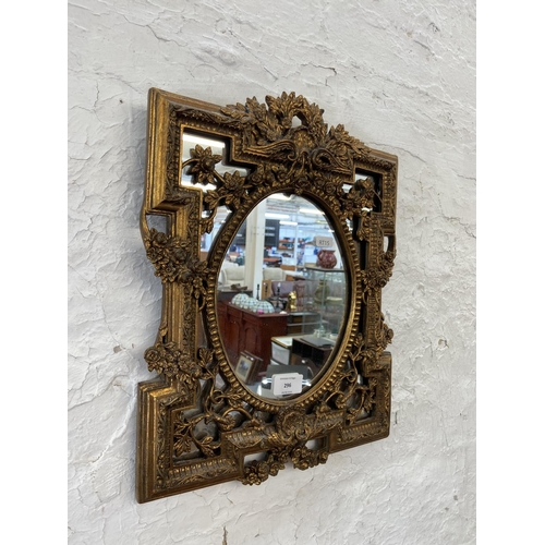 296 - A Rococo style gilt framed wall mirror - approx. 42cm high x 33cm wide