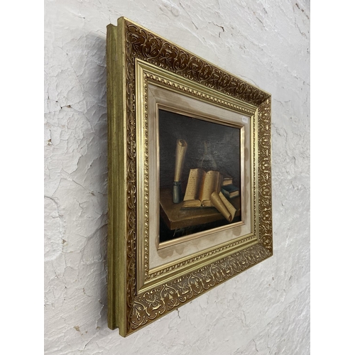 302 - A vintage gilt framed oil on board of a still life scene signed lower left - approx. 40cm high x 45c... 