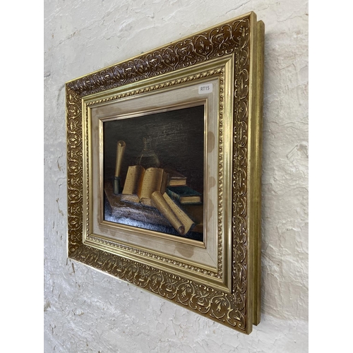 302 - A vintage gilt framed oil on board of a still life scene signed lower left - approx. 40cm high x 45c... 