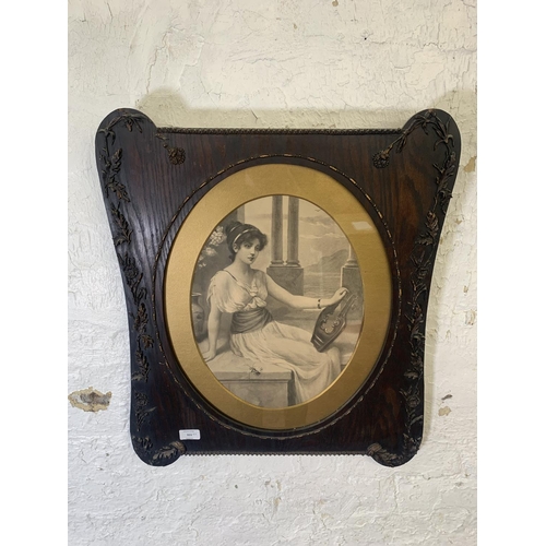 311 - A pair of late 19th century prints of ladies in Art Nouveau oak and gilt frames - approx. 64cm high ... 