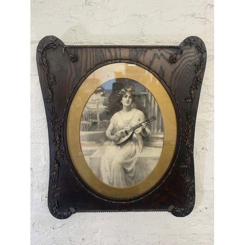 311 - A pair of late 19th century prints of ladies in Art Nouveau oak and gilt frames - approx. 64cm high ... 