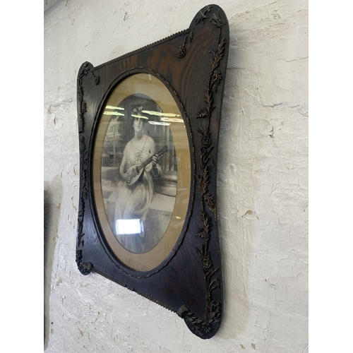 311 - A pair of late 19th century prints of ladies in Art Nouveau oak and gilt frames - approx. 64cm high ... 