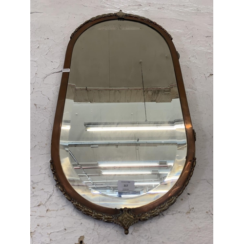 317 - An Art Deco copper and brass framed bevelled edge wall mirror - approx. 72cm high x 36cm wide