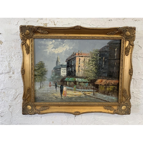 320A - Three 20th century gilt framed acrylic on canvas paintings of European street scenes - largest appro... 