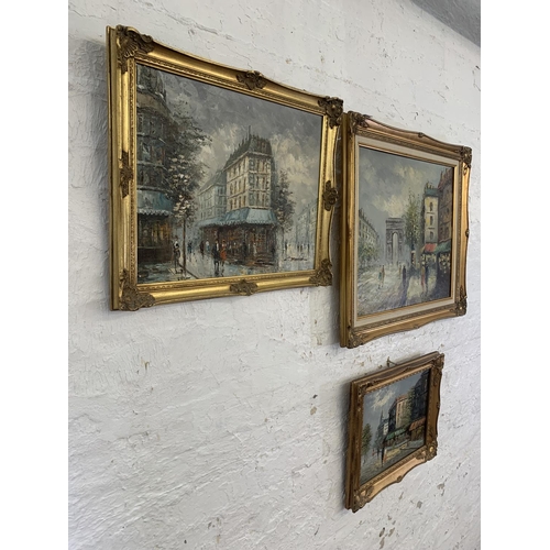 320A - Three 20th century gilt framed acrylic on canvas paintings of European street scenes - largest appro... 