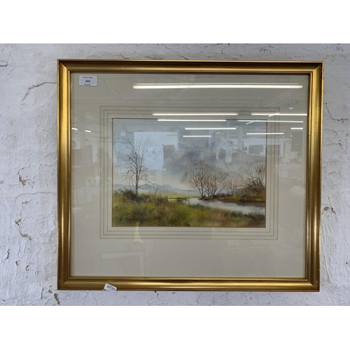 322 - A late 20th century gilt framed Impressionist style watercolour of a landscape signed lower left - a... 