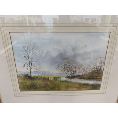 322 - A late 20th century gilt framed Impressionist style watercolour of a landscape signed lower left - a... 