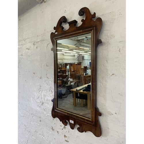 329 - A Georgian mahogany fretwork and parcel gilt wall mirror - approx. 93cm high x 49cm wide