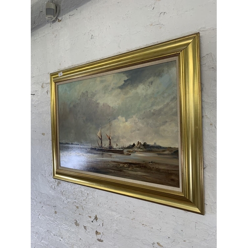 330 - A late 20th century gilt framed Ivan Taylor (b.1946) oil on board of a harbour scene - approx. 69cm ... 