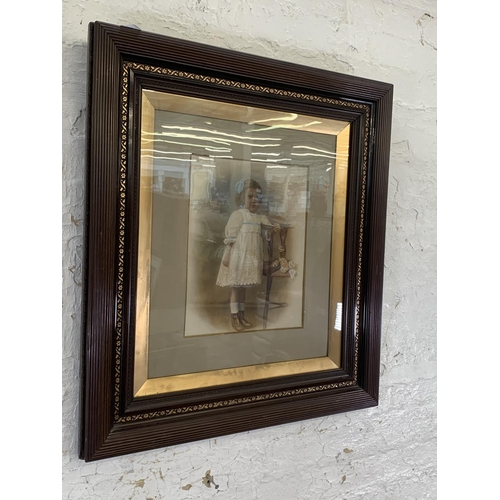 338 - A Victorian framed overpainted portrait of a young girl - approx. 79cm high x 70cm wide