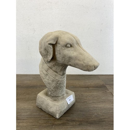 511 - A pair of cast concrete greyhound garden finials - approx. 27cm high