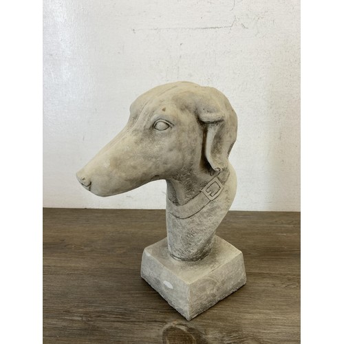 511 - A pair of cast concrete greyhound garden finials - approx. 27cm high