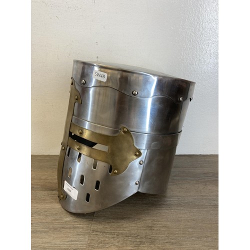 510 - A reproduction Medieval Templar Knight Crusader style brass and steel helmet - approx. 28cm high