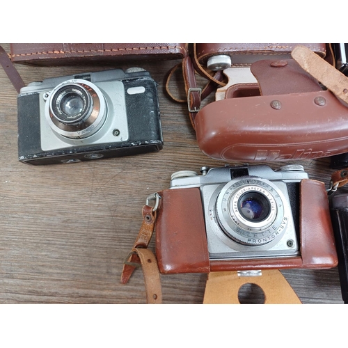 631 - A collection of vintage cameras to include Haking Halina 35X 35mm viewfinder, Luxette for 127 film, ... 