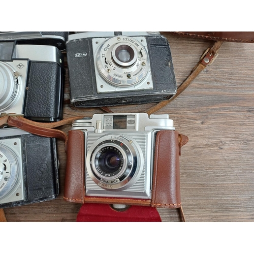 631 - A collection of vintage cameras to include Haking Halina 35X 35mm viewfinder, Luxette for 127 film, ... 