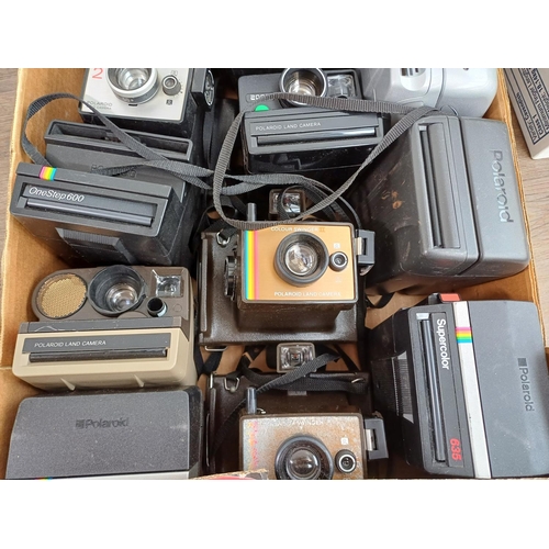 632 - Three boxes containing a large collection of Polaroid instant cameras to include boxed Image Elite, ... 