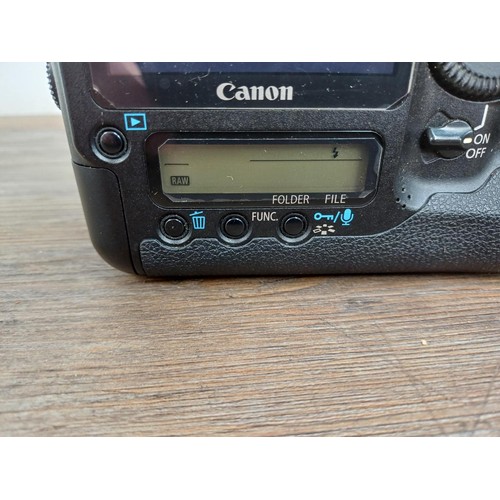 593 - A boxed Canon EOS-1Ds Mark III 21mp professional full-frame DSLR camera body with power adapter, str... 