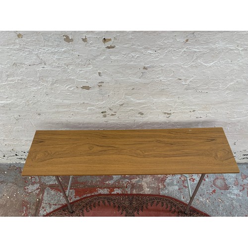 250B - A mid 20th century teak effect and tubular metal folding knitting machine table (associated with lot... 