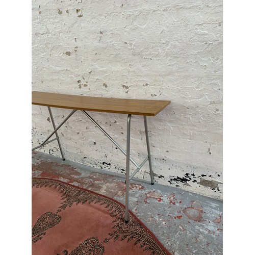 250B - A mid 20th century teak effect and tubular metal folding knitting machine table (associated with lot... 