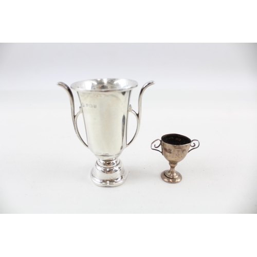 2190 - Two hallmarked sterling silver miniature trophies - approx. gross weight 32g