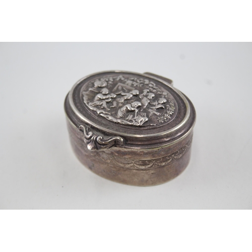 2193 - An .800 silver trinket box with cherub design - approx. gross weight 81g and 3cm high x 6.5cm wide x... 