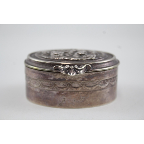 2193 - An .800 silver trinket box with cherub design - approx. gross weight 81g and 3cm high x 6.5cm wide x... 