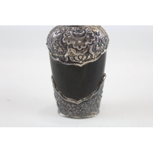 2200 - An antique carved horn scent bottle with .950 silver detailing