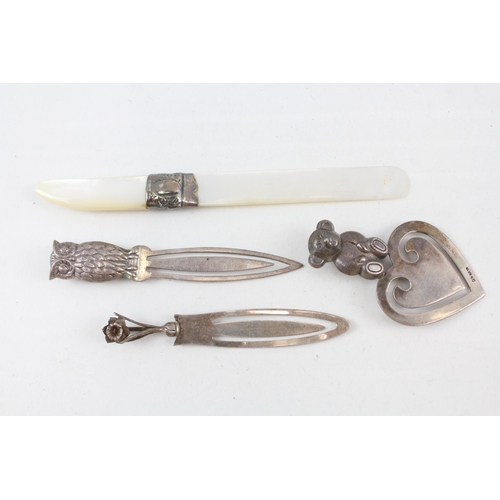 2203 - Four hallmarked sterling silver items, three bookmarks and one mother of pearl letter opener - appro... 