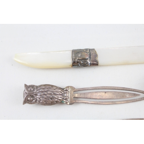 2203 - Four hallmarked sterling silver items, three bookmarks and one mother of pearl letter opener - appro... 