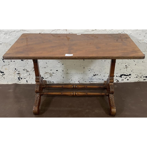 105 - A 19th century style mahogany coffee table with carved supports and lower stretcher - approx. 42cm h... 