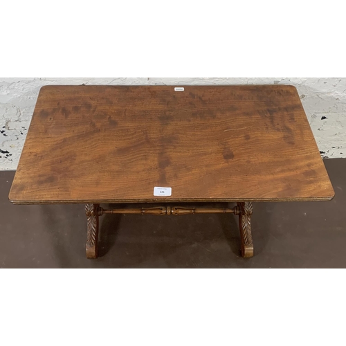 105 - A 19th century style mahogany coffee table with carved supports and lower stretcher - approx. 42cm h... 