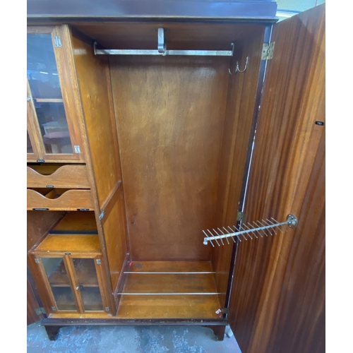 144 - A 1920s mahogany gentleman's compactum double wardrobe with fitted interior - approx. 181cm high x 1... 