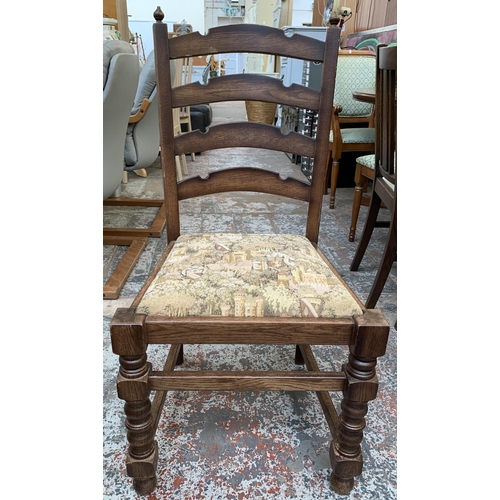 161 - An oak circular extending table on carved baluster support and four chairs - approx. 78cm high x 110... 