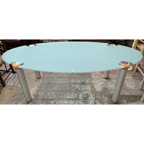 163 - A modern glass top dining table on hardwood and brushed steel supports - approx. 75cm high x 110cm w... 